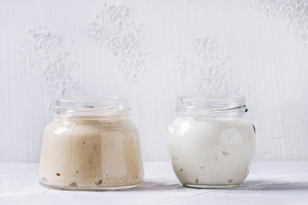 Wheat and white starters in glass jars